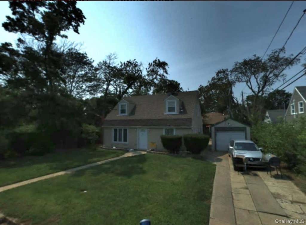 Photo of 4 Clover Lane, Westbury, NY 11590 (MLS # 1008970)