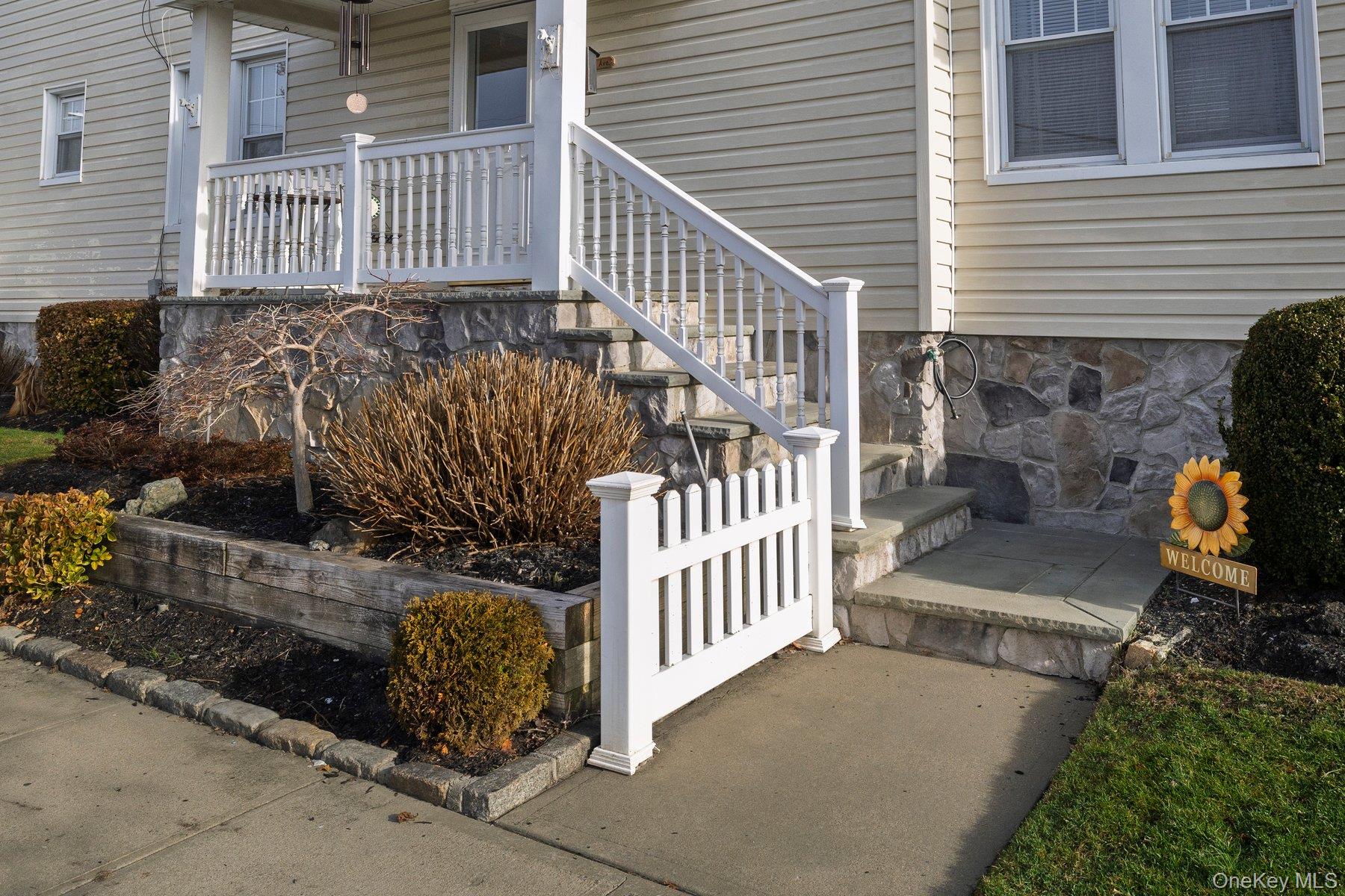Slate Pavers leading to Covered Patio Front Entrance and sitting area