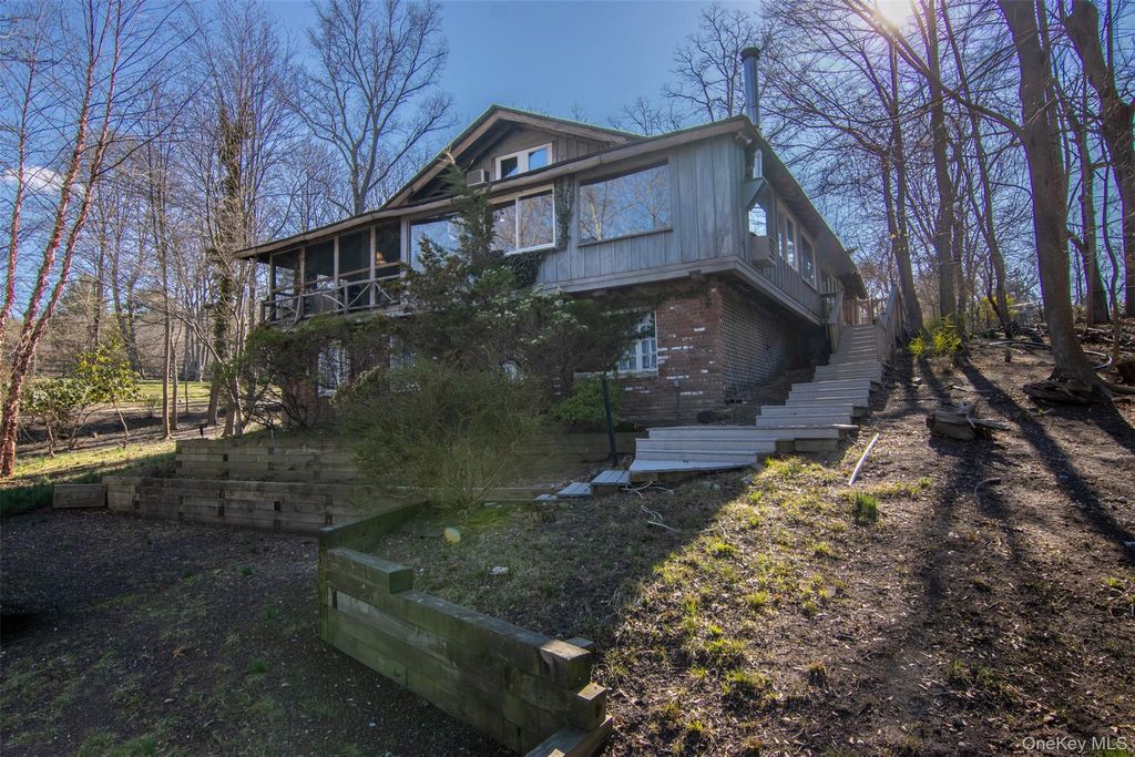 Photo of 10 Tagliabue Road, Shoreham, NY 11786 (MLS # 981677)