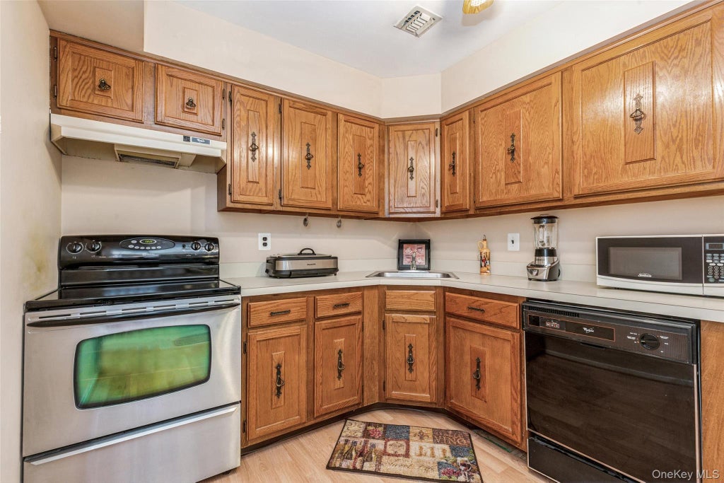 Photo of 6 Cambridge Drive W, Copiague, NY 11726 (MLS # 1050820)