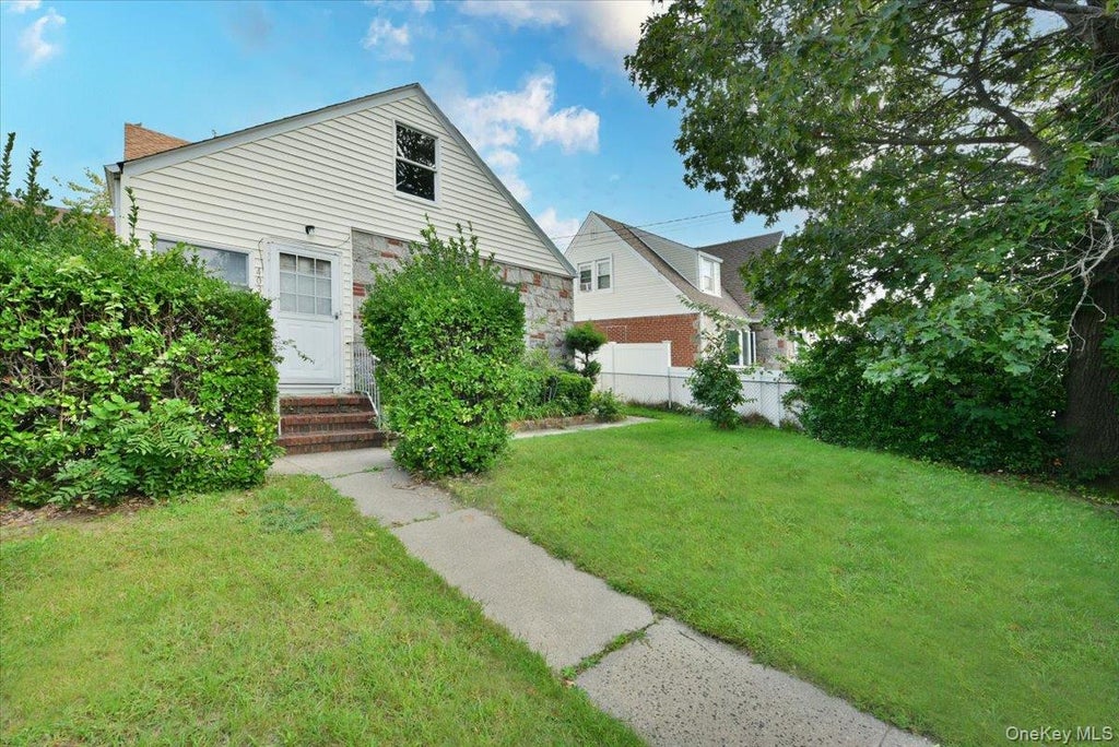 Photo of 403 Oak Street, Copiague, NY 11726 (MLS # 1054015)