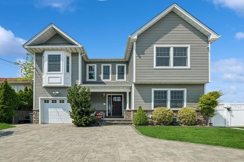 Photo of 26 Island Parkway N, Island Park, NY 11558 (MLS # 877670)
