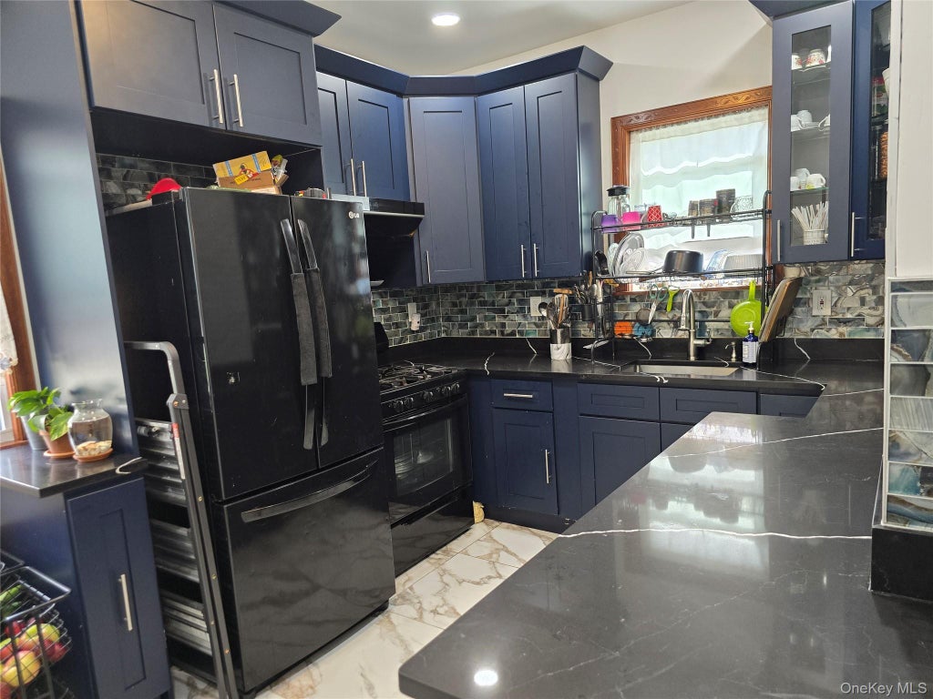 Photo of 87 65 95th ST St, Flushing, NY 11421 (MLS # 1029362)