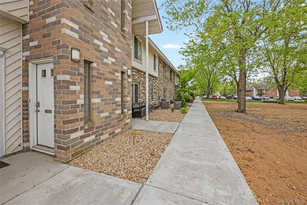 Photo of 10 Aspen Court Ct #10, Coram, NY 11727 (MLS # 1000217)