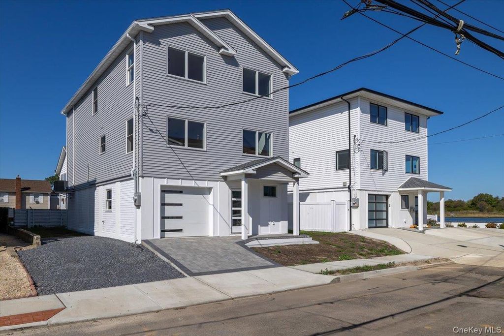 Photo of 12 Pershing Place, Island Park, NY 11558 (MLS # 874176)