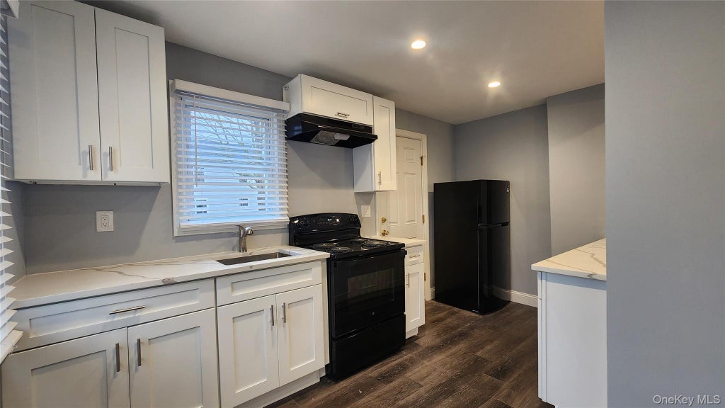 Photo of 104 Moriches Drive, Mastic Beach, NY 11951 (MLS # 1058477)