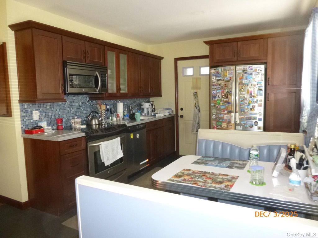 Photo of 71 Carroll Street, Brentwood, NY 11717 (MLS # 941850)