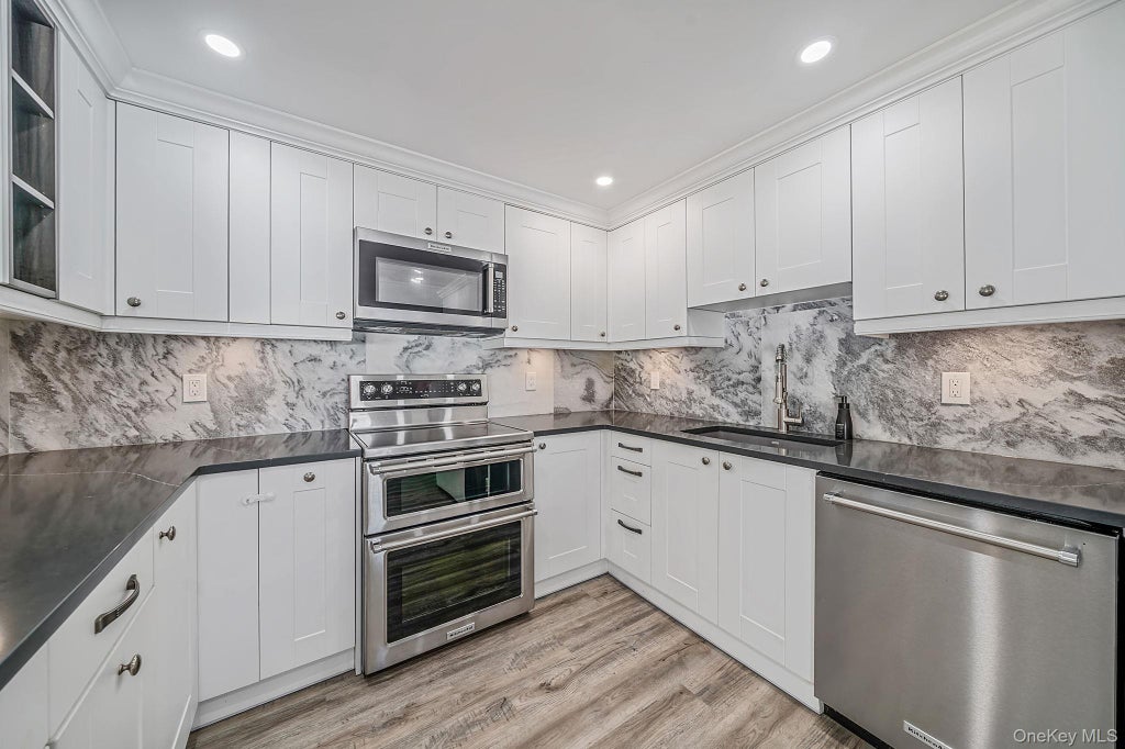 Photo of 457 Peconic Street, Ronkonkoma, NY 11779 (MLS # 1034912)