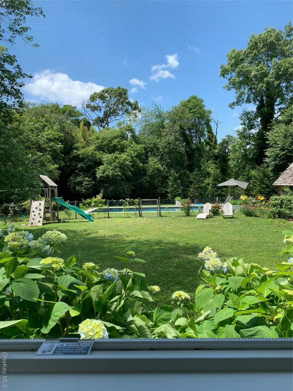 Photo of 36 S Howells Point Road, Bellport Village, NY 11713 (MLS # 975819)