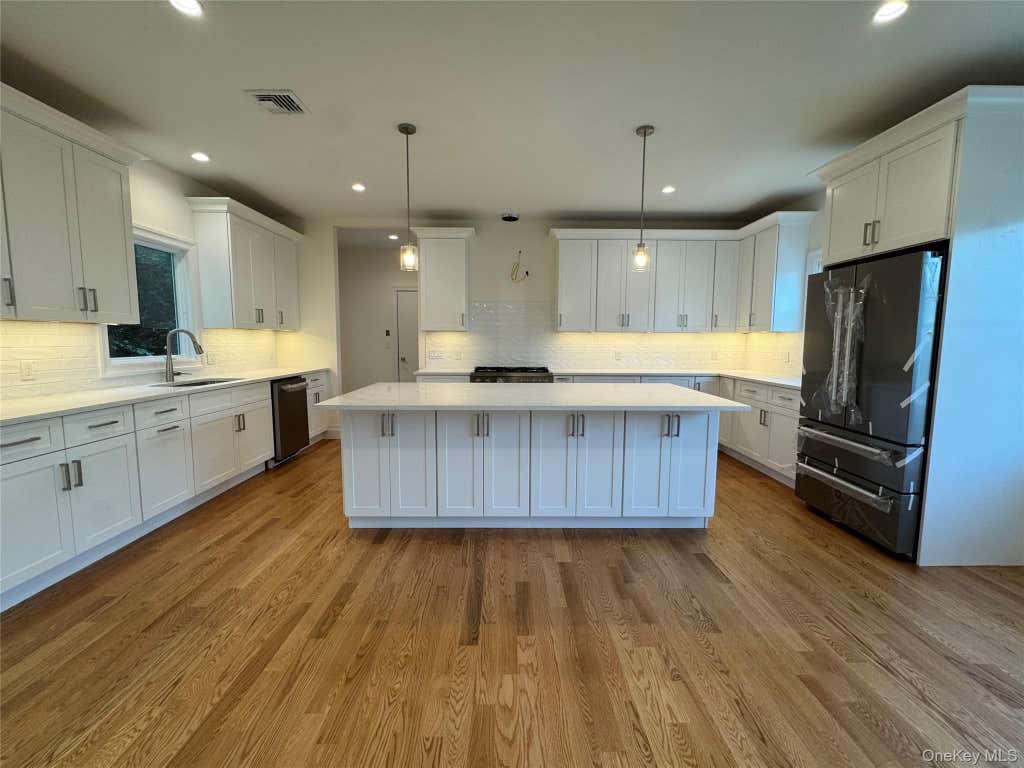 Photo of 9 First Street, Glenwood Landing, NY 11547 (MLS # 1023642)