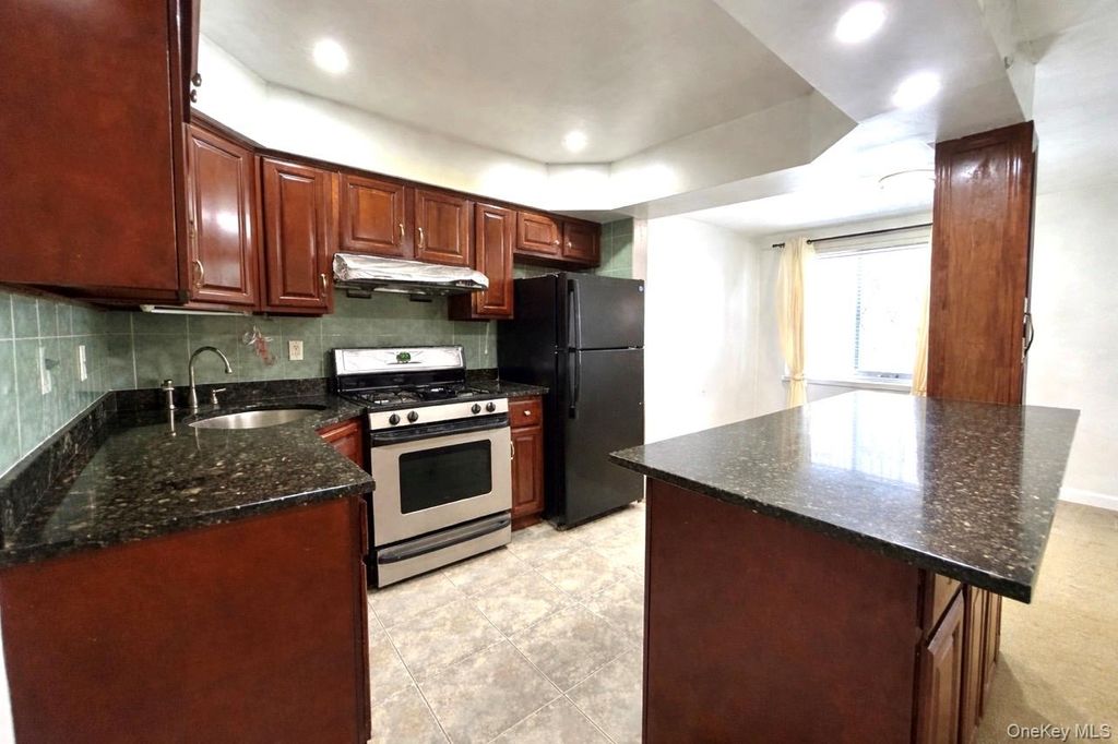 Photo of 84-52 57th Avenue, Elmhurst, NY 11373 (MLS # 977644)