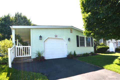 Photo of 105 W Village Circle #105, Manorville, NY 11949 (MLS # 1029061)