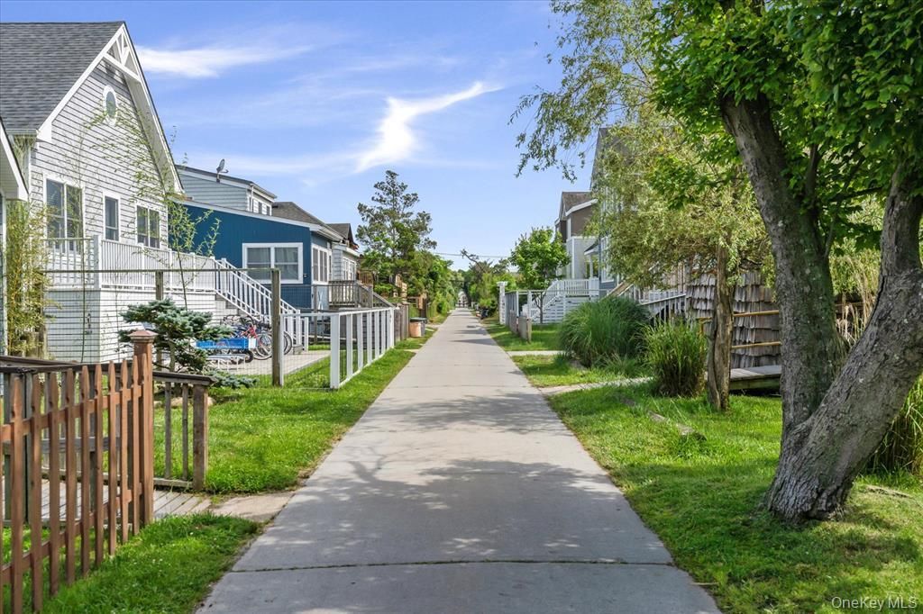 Photo of 17 Bungalow Walk, Ocean Beach, NY 11770 (MLS # 986562)