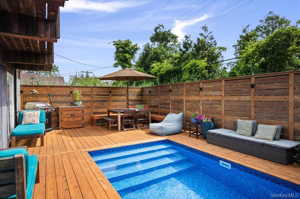 Photo of 17 Bungalow Walk, Ocean Beach, NY 11770 (MLS # 986562)