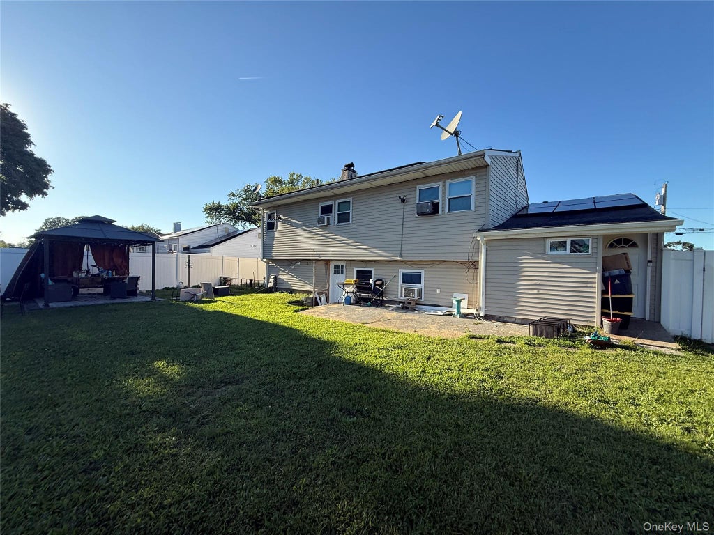 Photo of 14 Harrison Street, Brentwood, NY 11717 (MLS # 1050145)