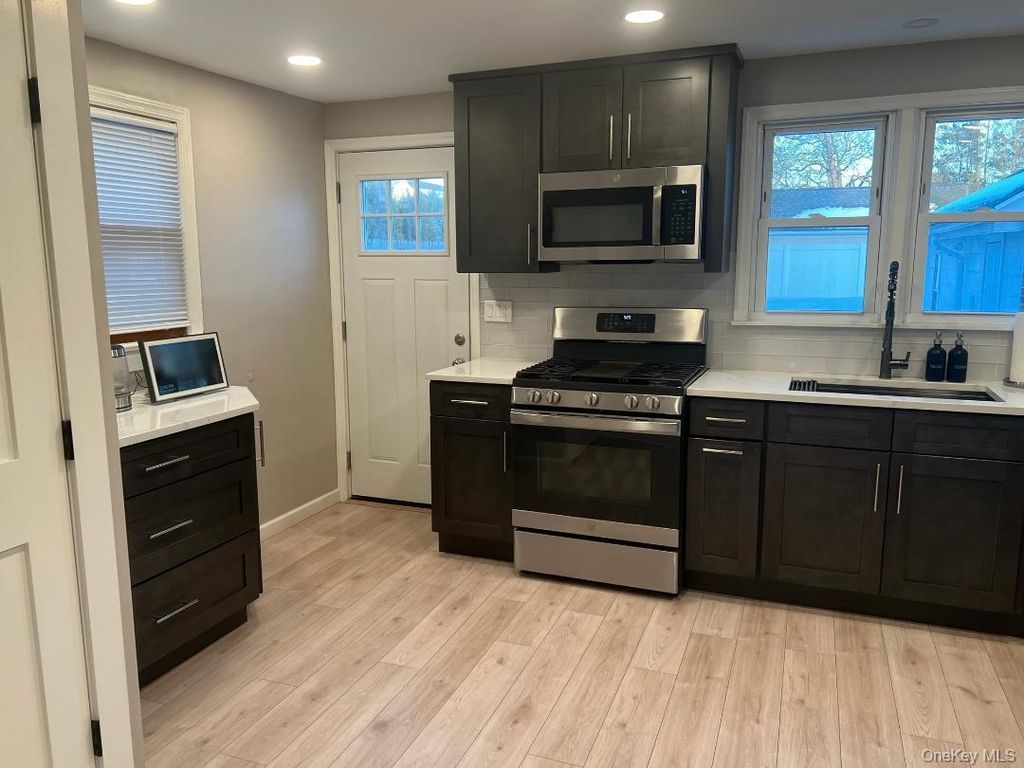 Photo of 25 Wood Avenue, Patchogue, NY 11772 (MLS # 965773)