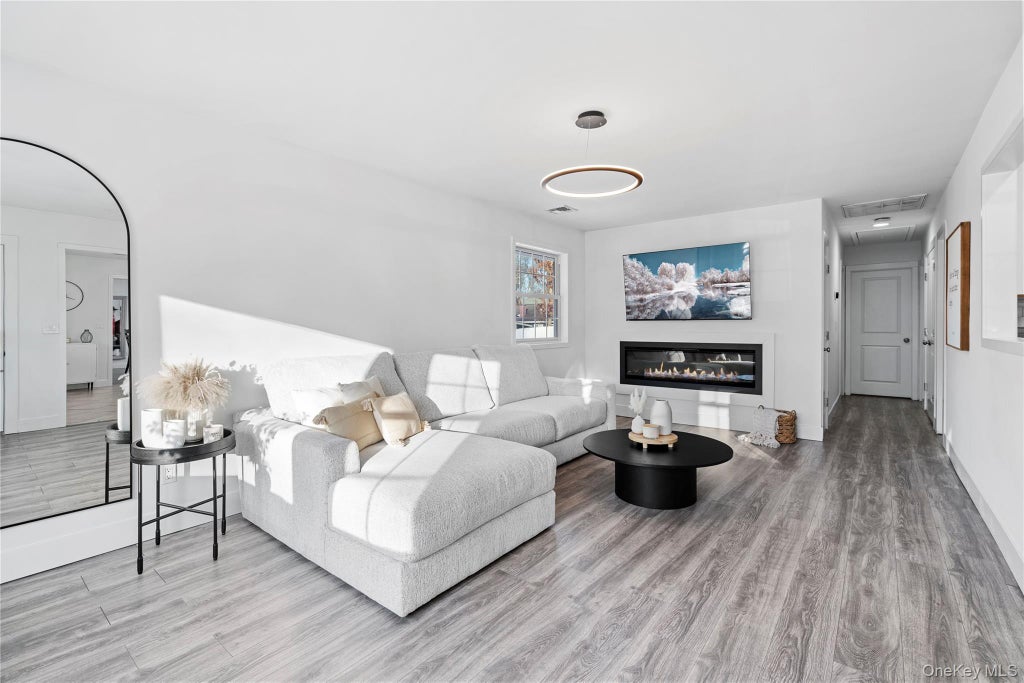Photo of 63 Orchard Street, Manorville, NY 11949 (MLS # 1010903)