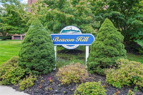 Photo of 113 Beacon Hill Dr DR #E25, Dobbs Ferry, NY 10522 (MLS # 1035694)