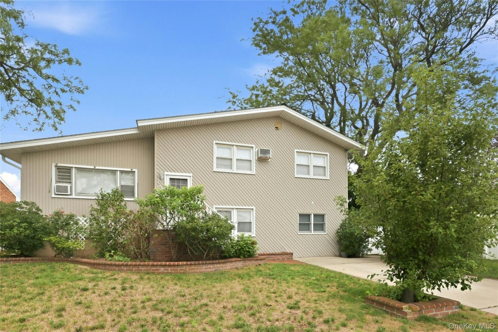 Photo of 228 Island Parkway W, Island Park, NY 11558 (MLS # 1030642)