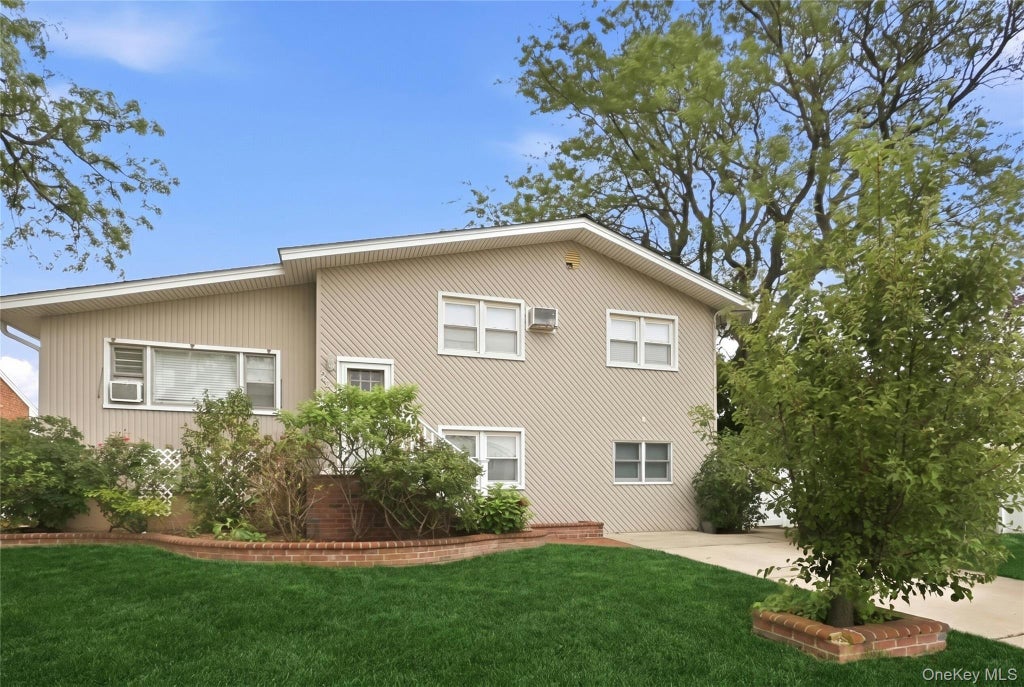 Photo of 228 Island Parkway W, Island Park, NY 11558 (MLS # 1030642)