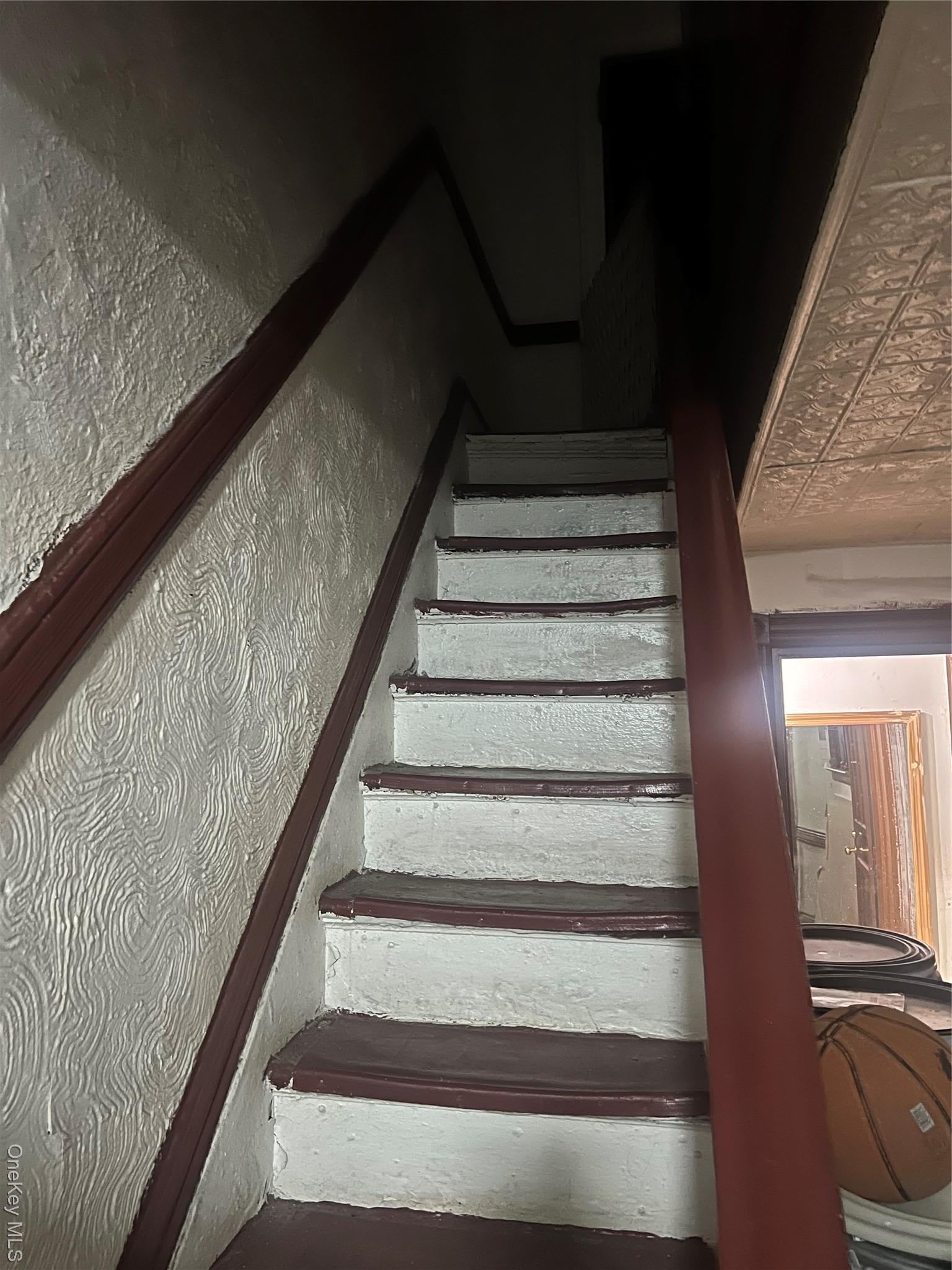 Staircase with an ornate ceiling