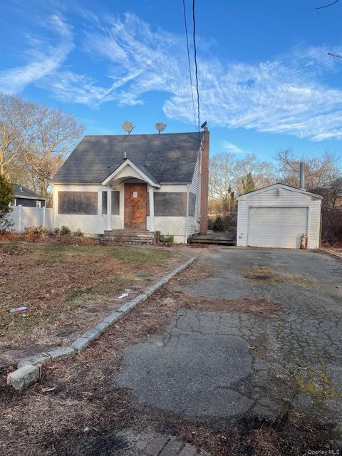 Photo of 77 Poospatuck Lane, Mastic, NY 11950 (MLS # 945657)