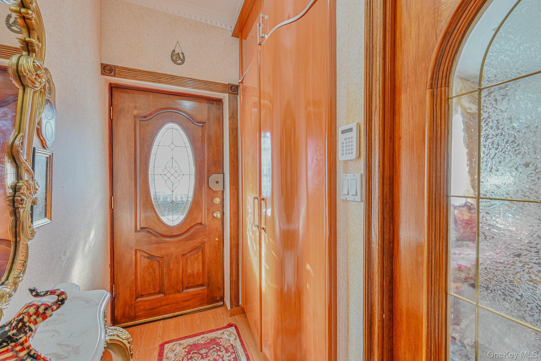 Entrance foyer featuring wood finished floors