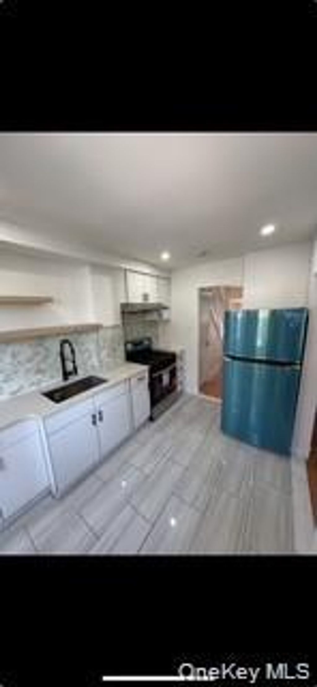 Photo of 6125 Saunders Street, Rego Park, NY 11374 (MLS # 1002017)