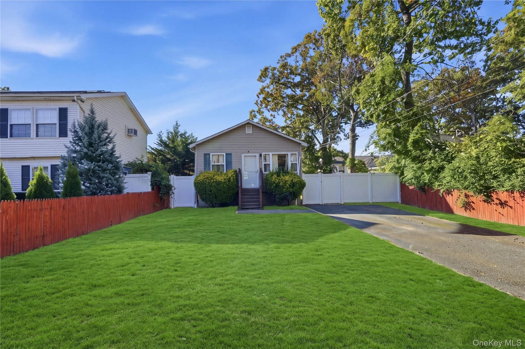 Photo of 94 Commonwealth Drive, Wyandanch, NY 11798 (MLS # 1066405)