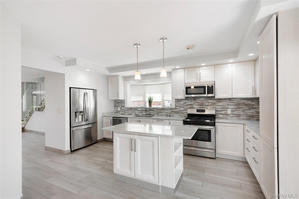 Photo of 191 Beach 140th Street, Rockaway Park, NY 11694 (MLS # 1034677)