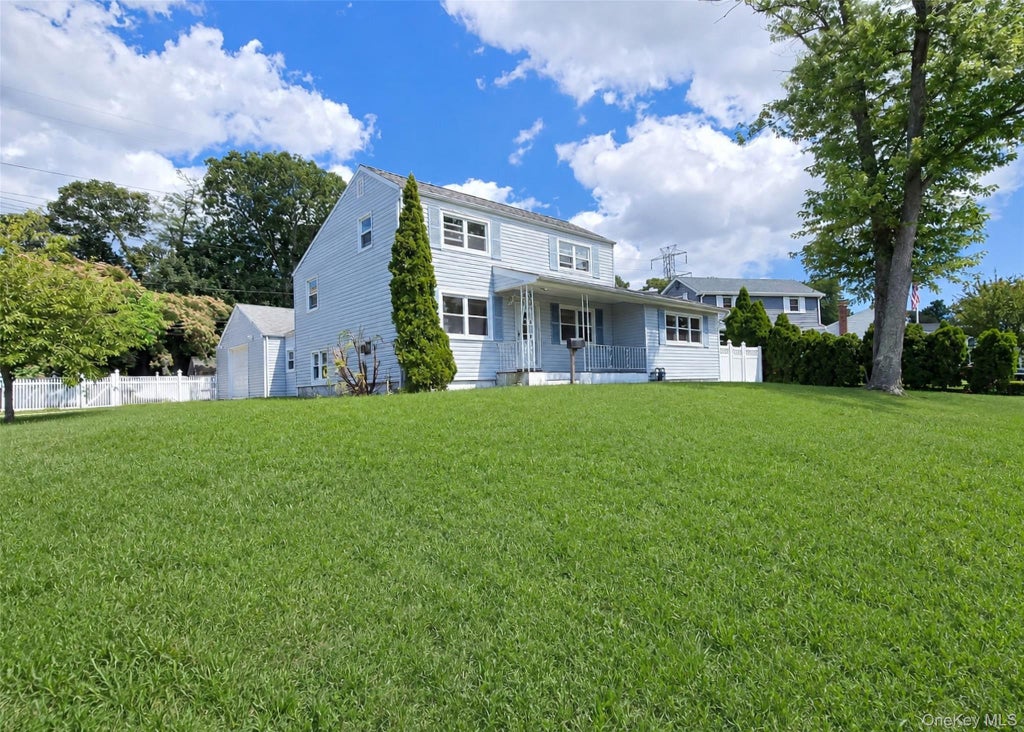 Photo of 290 Eastwood Boulevard, Centereach, NY 11720 (MLS # 1018799)