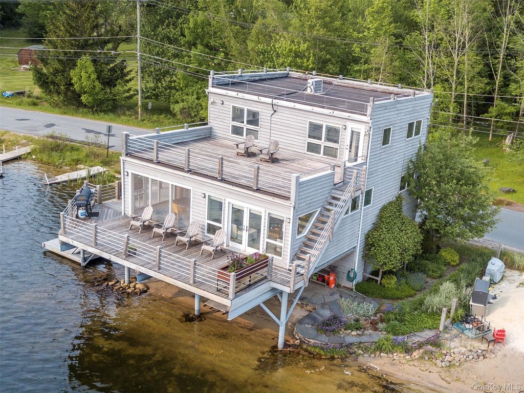 Photo of 13 W Shore Road, Swan Lake, NY 12783 (MLS # 963096)