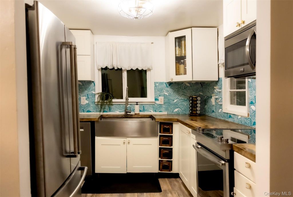 Photo of 50 Poseidon Road, Rocky Point, NY 11778 (MLS # 944007)