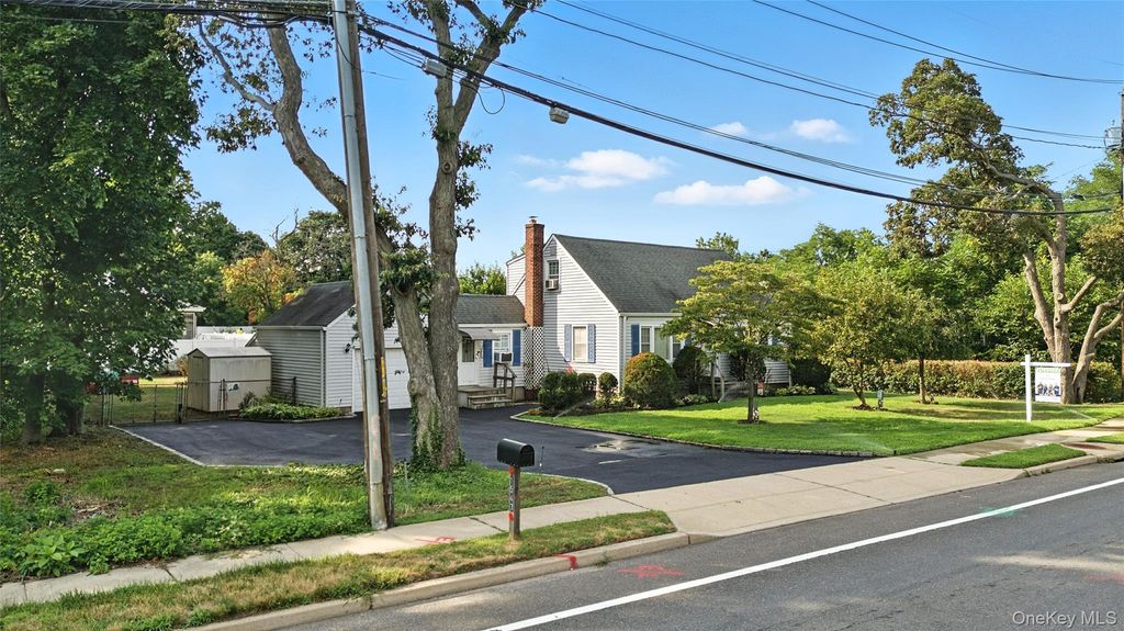 Photo of 1547 Walt Whitman Road, Melville, NY 11747 (MLS # 953942)