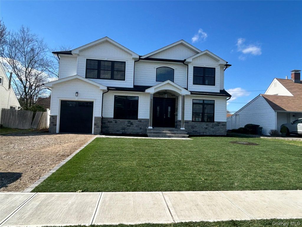 Photo of 119 Choir Lane, Westbury, NY 11590 (MLS # 975365)