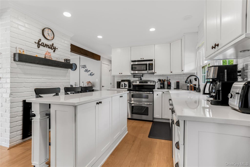 Photo of 93 Duckpond Drive N, Wantagh, NY 11793 (MLS # 1033021)