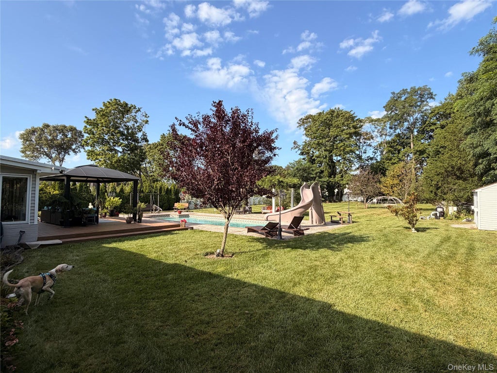 Photo of 6 N Howells Point Road, Bellport Village, NY 11713 (MLS # 1039319)