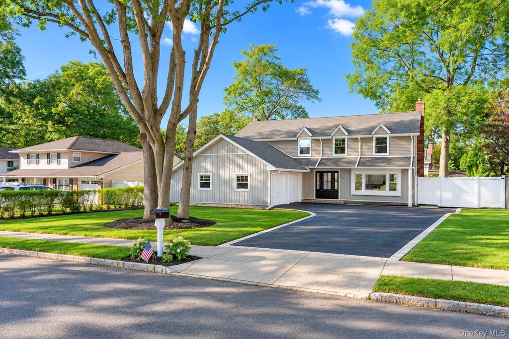 Photo of 9 Sussex Lane, Lake Grove, NY 11755 (MLS # 1059693)