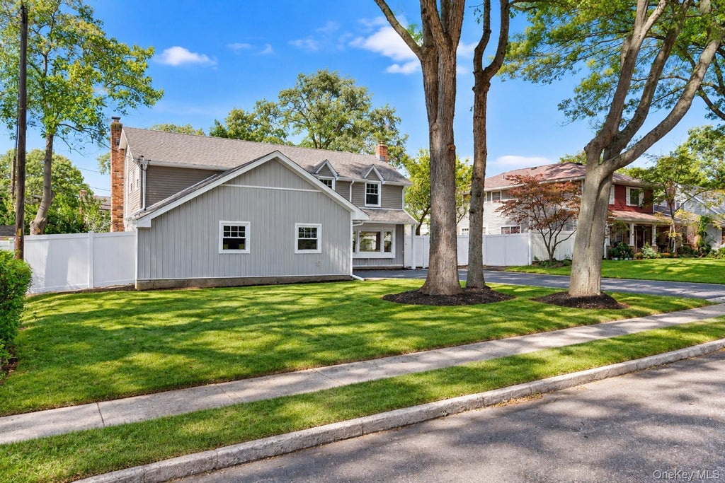 Photo of 9 Sussex Lane, Lake Grove, NY 11755 (MLS # 1059693)