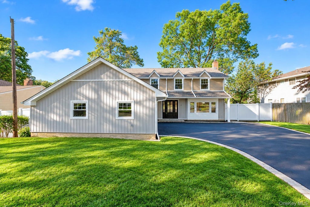 Photo of 9 Sussex Lane, Lake Grove, NY 11755 (MLS # 1059693)