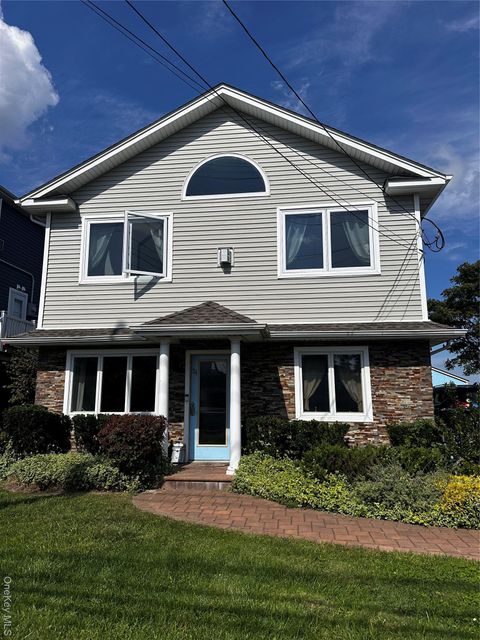 Photo of 34 Waterford Road, Island Park, NY 11558 (MLS # 913810)