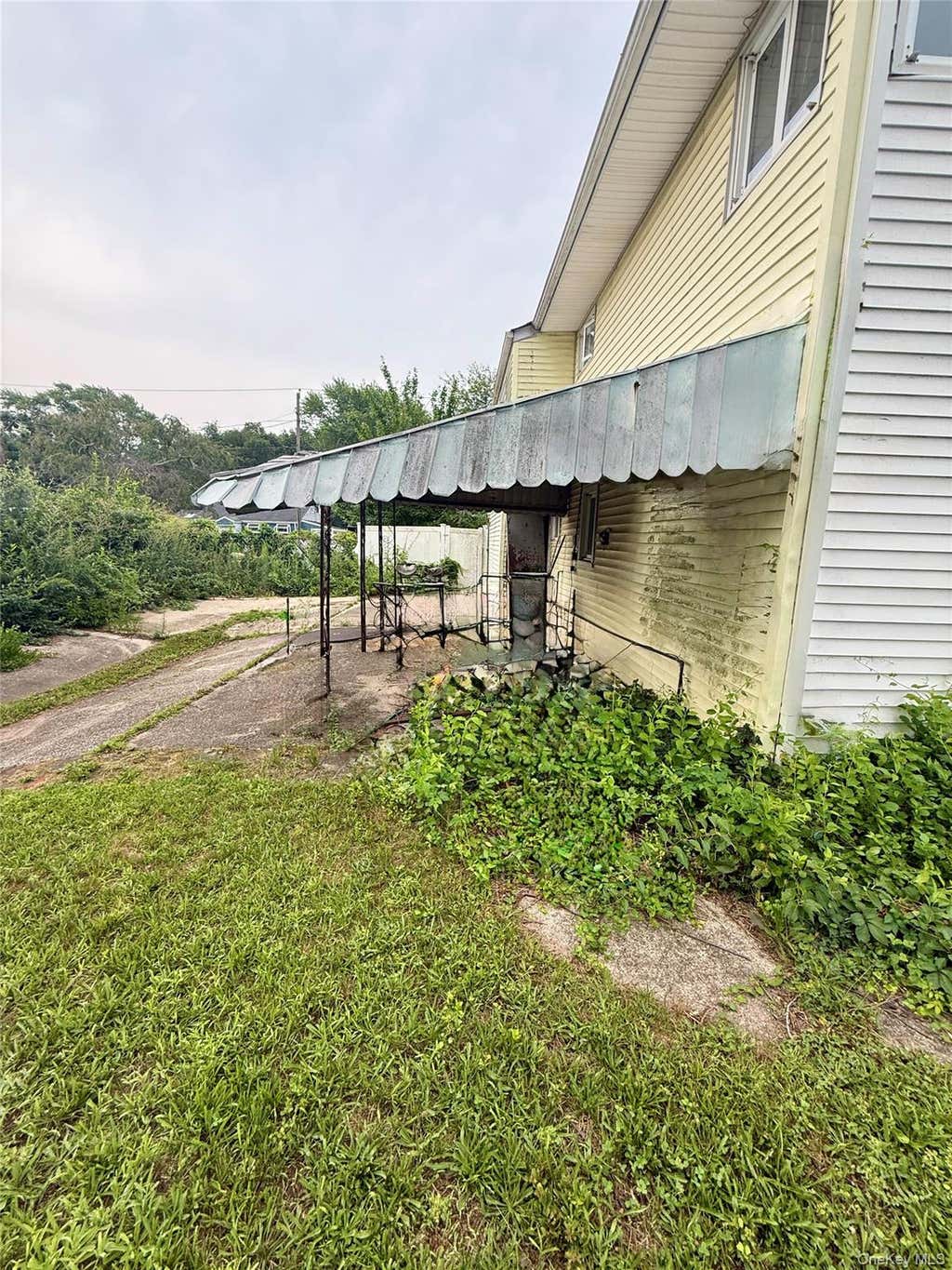 Photo of 411 Mayflower Avenue, Brentwood, NY 11717 (MLS # 1028270)