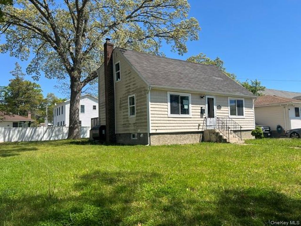 Photo of 216 Manhattan Avenue, Roosevelt, NY 11575 (MLS # 1001584)