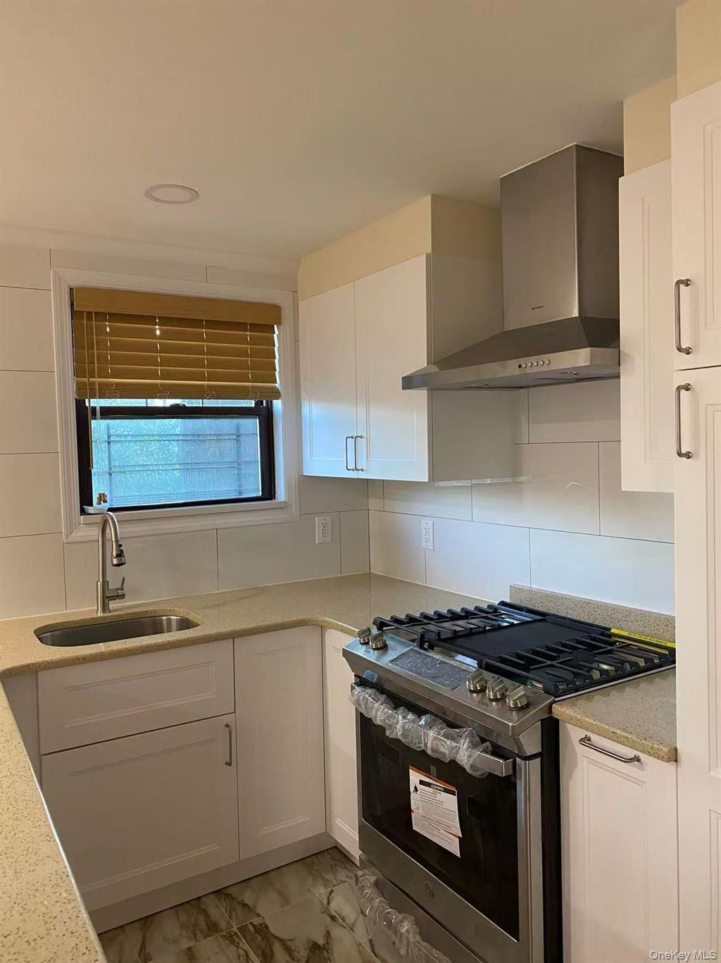 Photo of 67-97 136th Street St #A, Flushing, NY 11367 (MLS # 1027702)