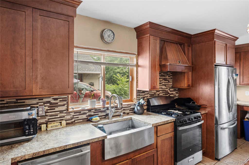 Photo of 547 Sunnybrook Drive, Oceanside, NY 11572 (MLS # 1025229)
