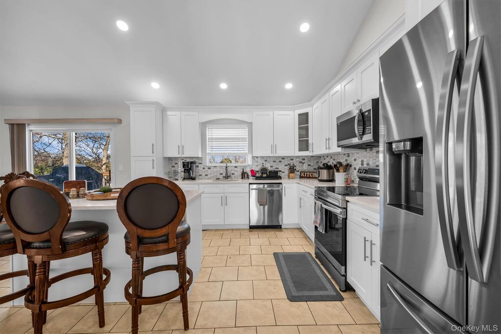 Photo of 19 Summit Pl, Farmingville, NY 11738 (MLS # 961421)