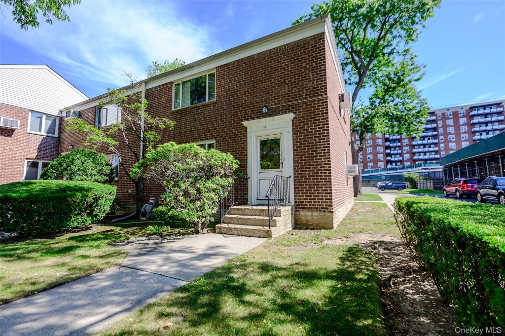 Photo of 18-11 212 Street St #101, Bayside, NY 11360 (MLS # 1057130)