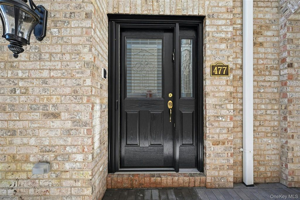 Photo of 477 Pacing Way, Westbury, NY 11590 (MLS # 985533)