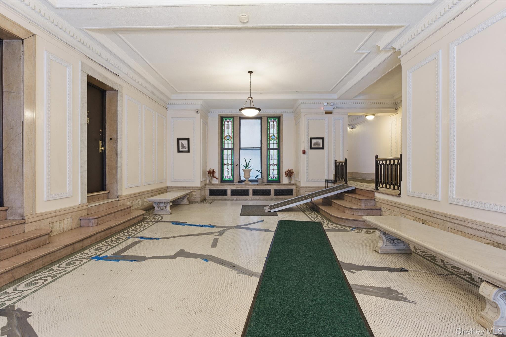 Building lobby featuring a decorative wall and ornamental molding