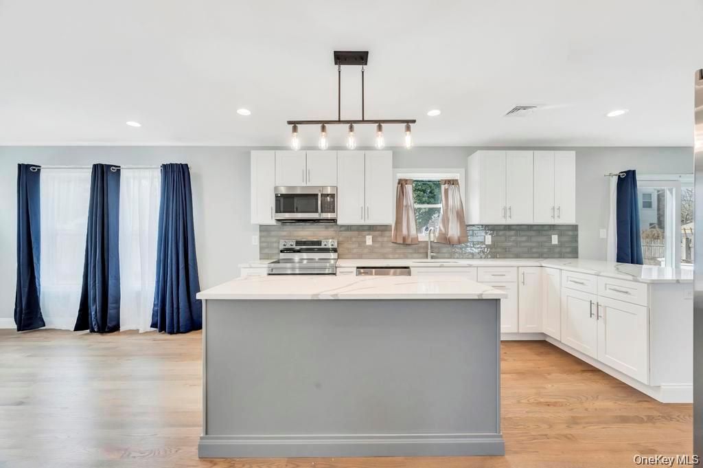 Photo of 42 Volta Drive, Deer Park, NY 11729 (MLS # 988985)